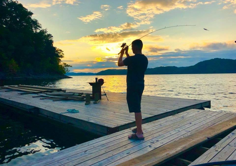 man fishing from dock